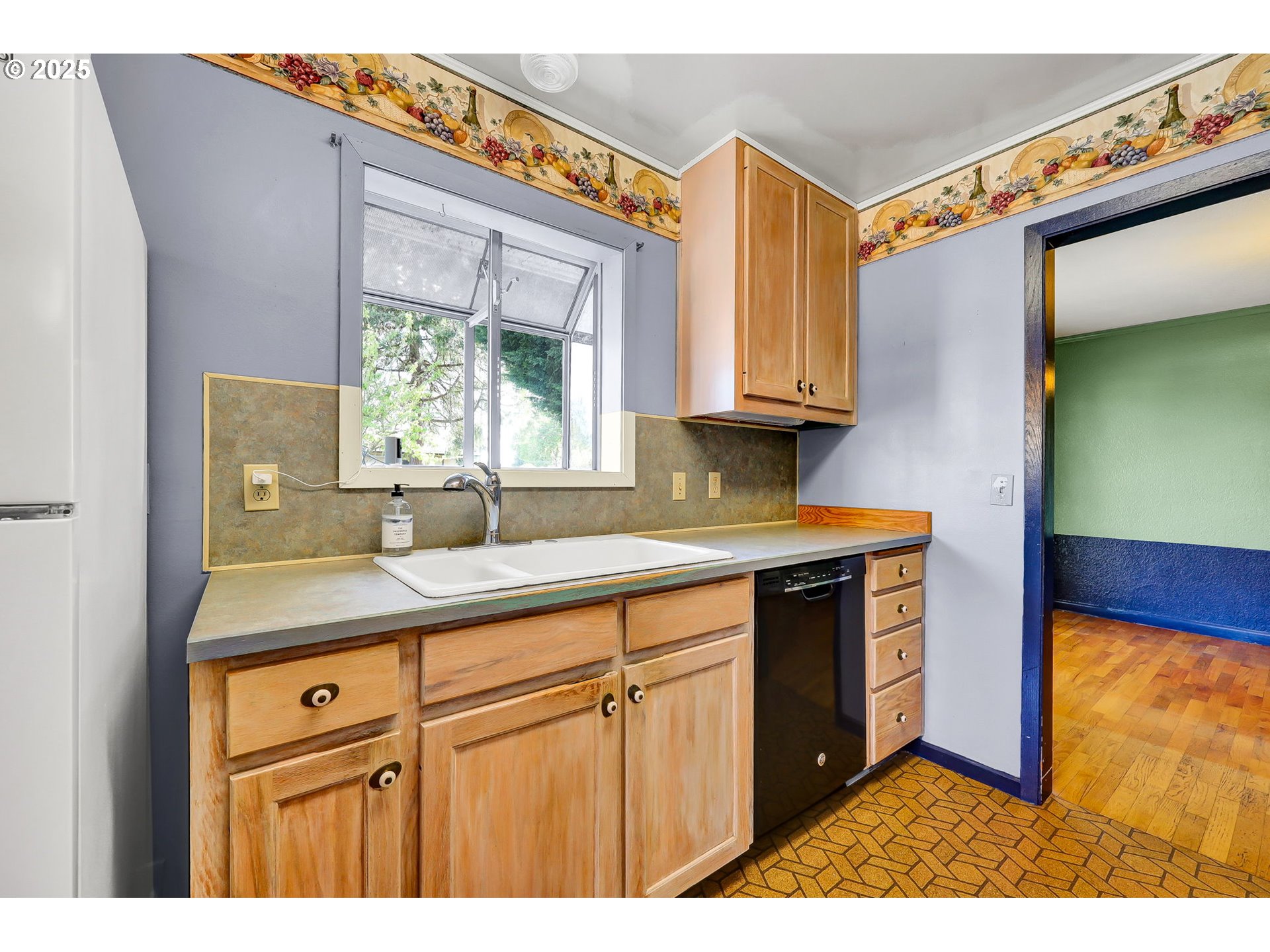 4150 Barger Drive Eugene, OR 97402 - Photo 11 of 28 a kitchen with a sink a window and cabinets