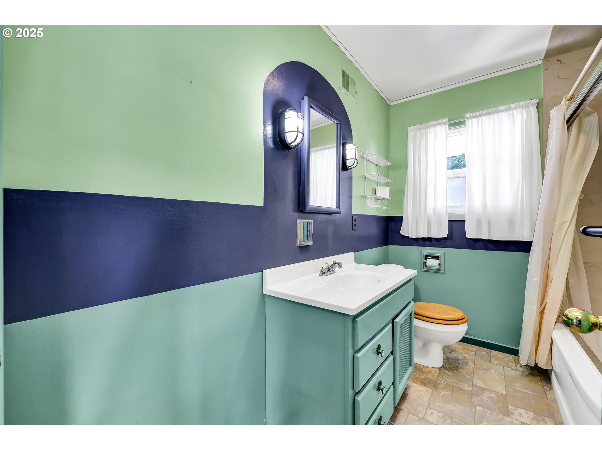 4150 Barger Drive Eugene, OR 97402 - Photo 13 of 28 a bathroom with a sink a toilet and a mirror