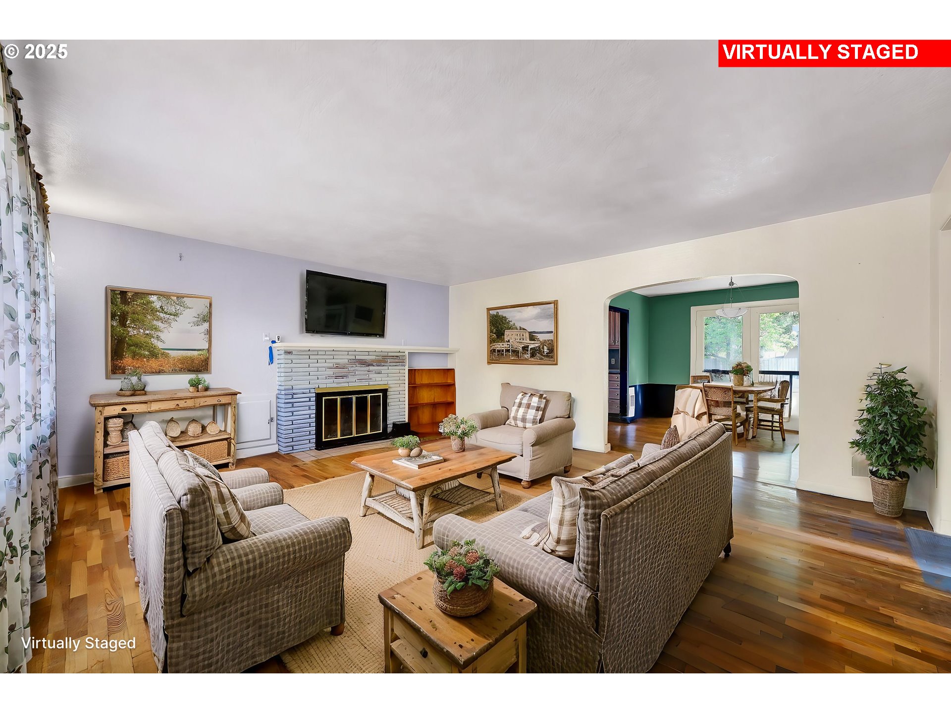 4150 Barger Drive Eugene, OR 97402 - Photo 25 of 28 a living room with furniture a fireplace and a flat screen tv