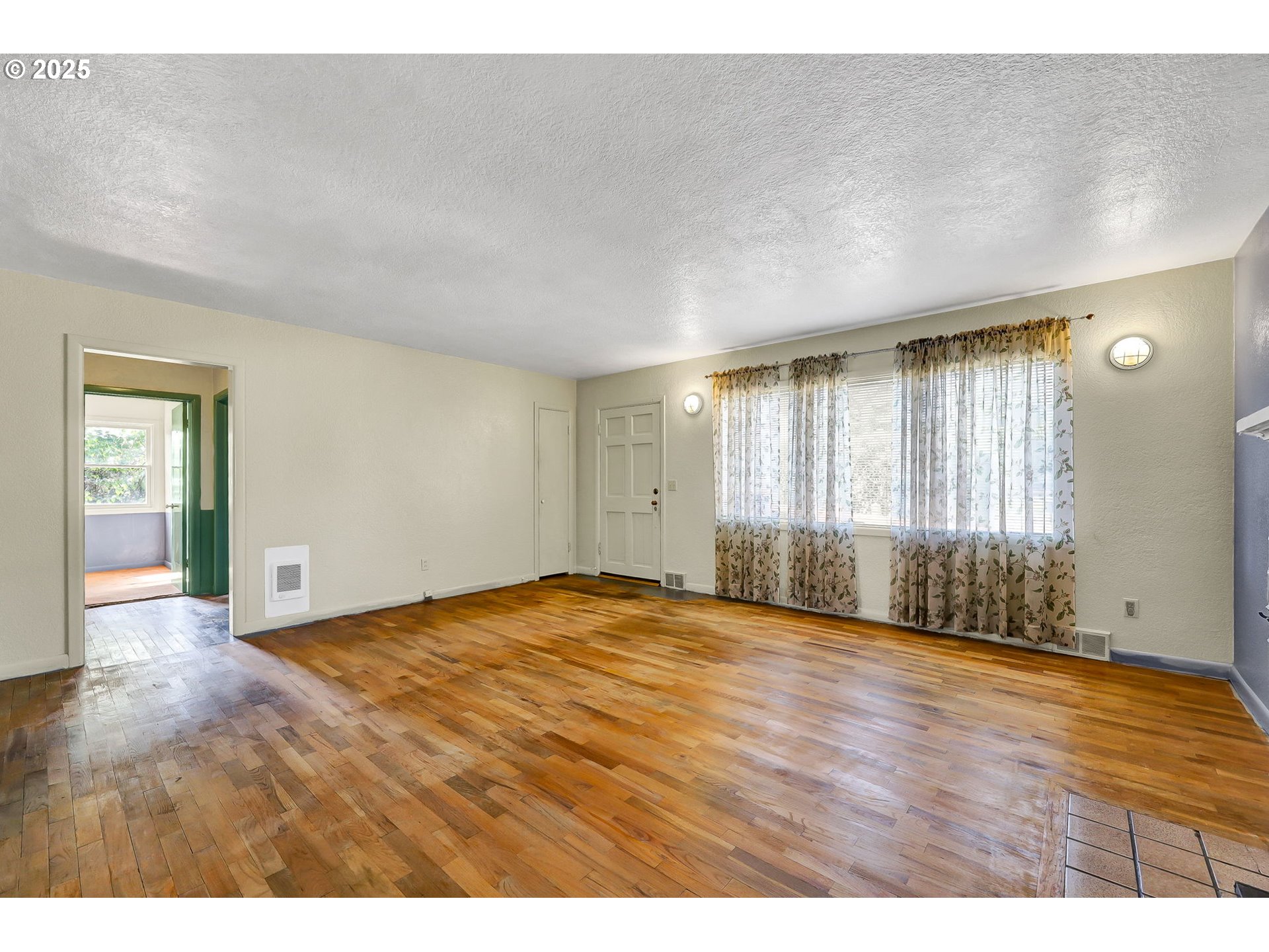 4150 Barger Drive Eugene, OR 97402 - Photo 5 of 28 a view of an empty room with wooden floor and a window