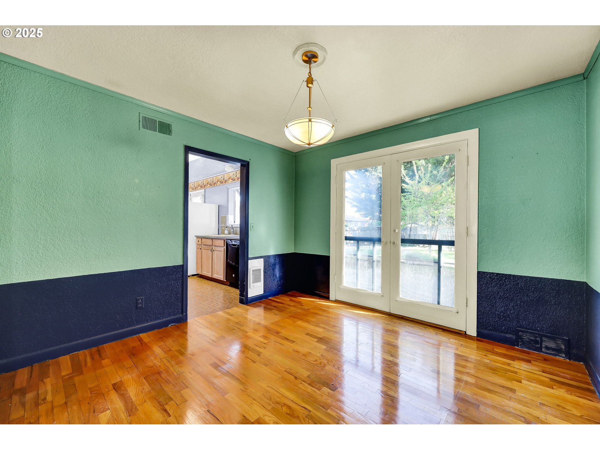4150 Barger Drive Eugene, OR 97402 - Photo 9 of 28 a view of an empty room with a window and wooden floor