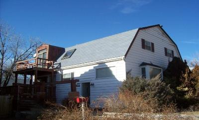 3095 Depew Street Wheat Ridge, CO 80214 - Photo 1 of 1 a view of a house with a small yard and potted plants