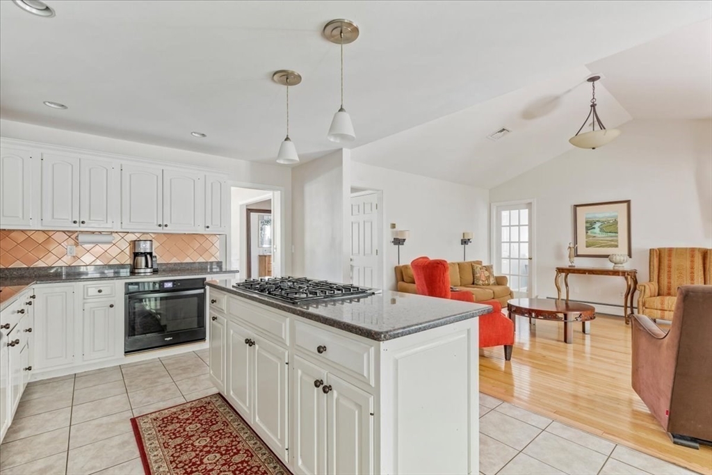39 Waterfall Road Acushnet, MA 02743 - Photo 12 of 32 a kitchen that has a lot of cabinets in it and wooden floors