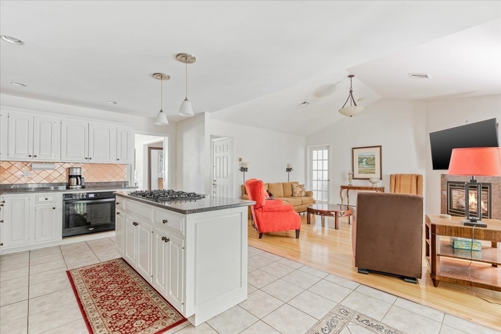 39 Waterfall Road Acushnet, MA 02743 - Photo 13 of 32 a open kitchen with stainless steel appliances granite countertop a stove and a refrigerator