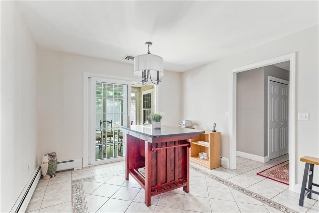 39 Waterfall Road Acushnet, MA 02743 - Photo 14 of 32 a view of kitchen with granite countertop stove top oven and cabinets