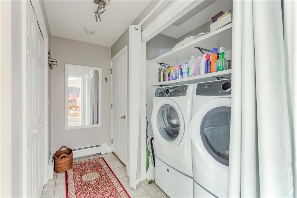 39 Waterfall Road Acushnet, MA 02743 - Photo 18 of 32 a view of a bedroom with washer and dryer