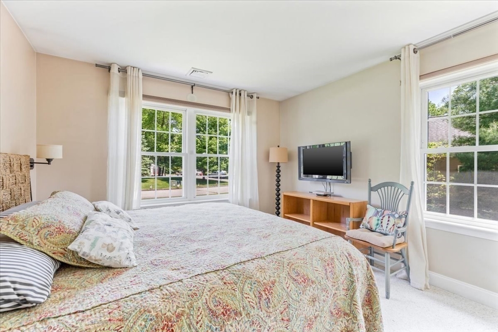 39 Waterfall Road Acushnet, MA 02743 - Photo 24 of 32 a bedroom with a bed and a flat screen tv