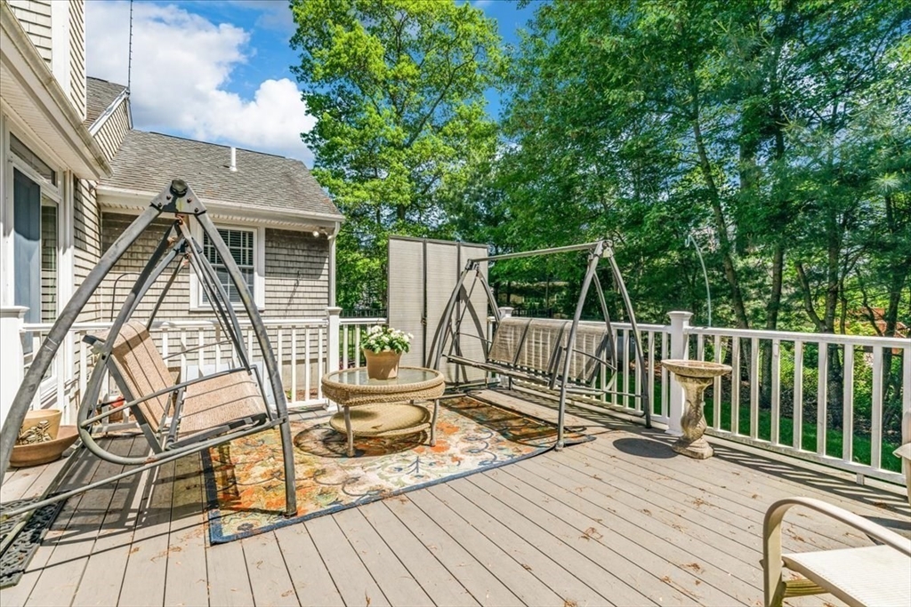 39 Waterfall Road Acushnet, MA 02743 - Photo 26 of 32 a view of a deck with two chair and wooden floor