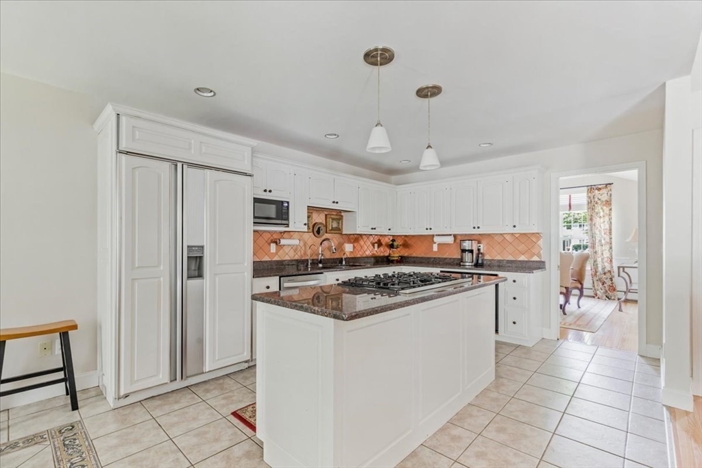 39 Waterfall Road Acushnet, MA 02743 - Photo 9 of 32 a kitchen with stainless steel appliances granite countertop a stove and a refrigerator