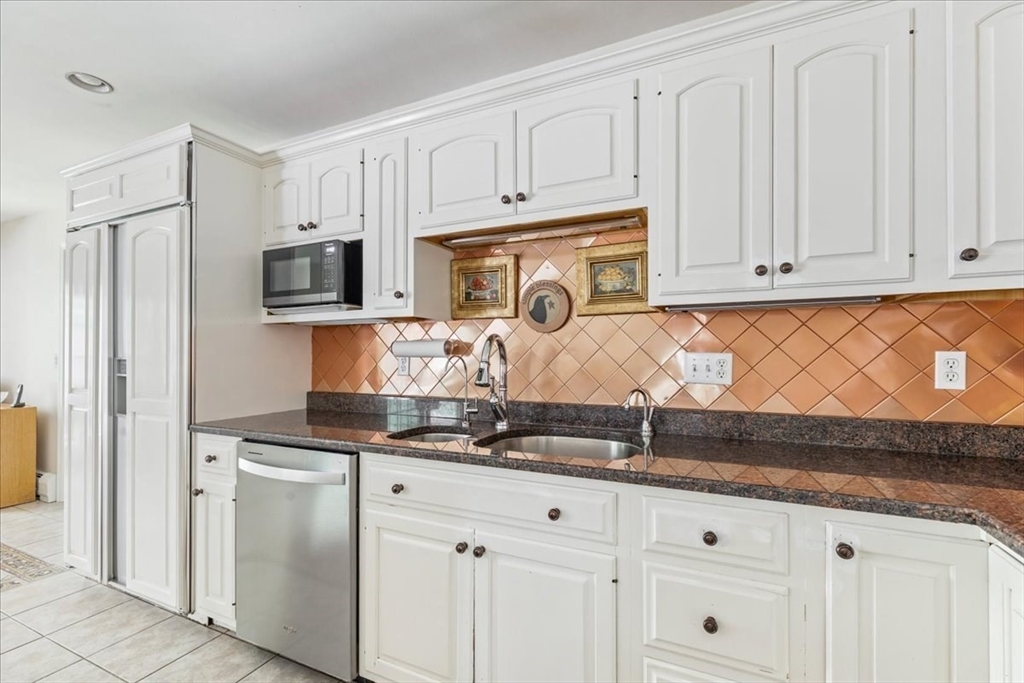 39 Waterfall Road Acushnet, MA 02743 - Photo 10 of 32 a kitchen with granite countertop white cabinets and sink
