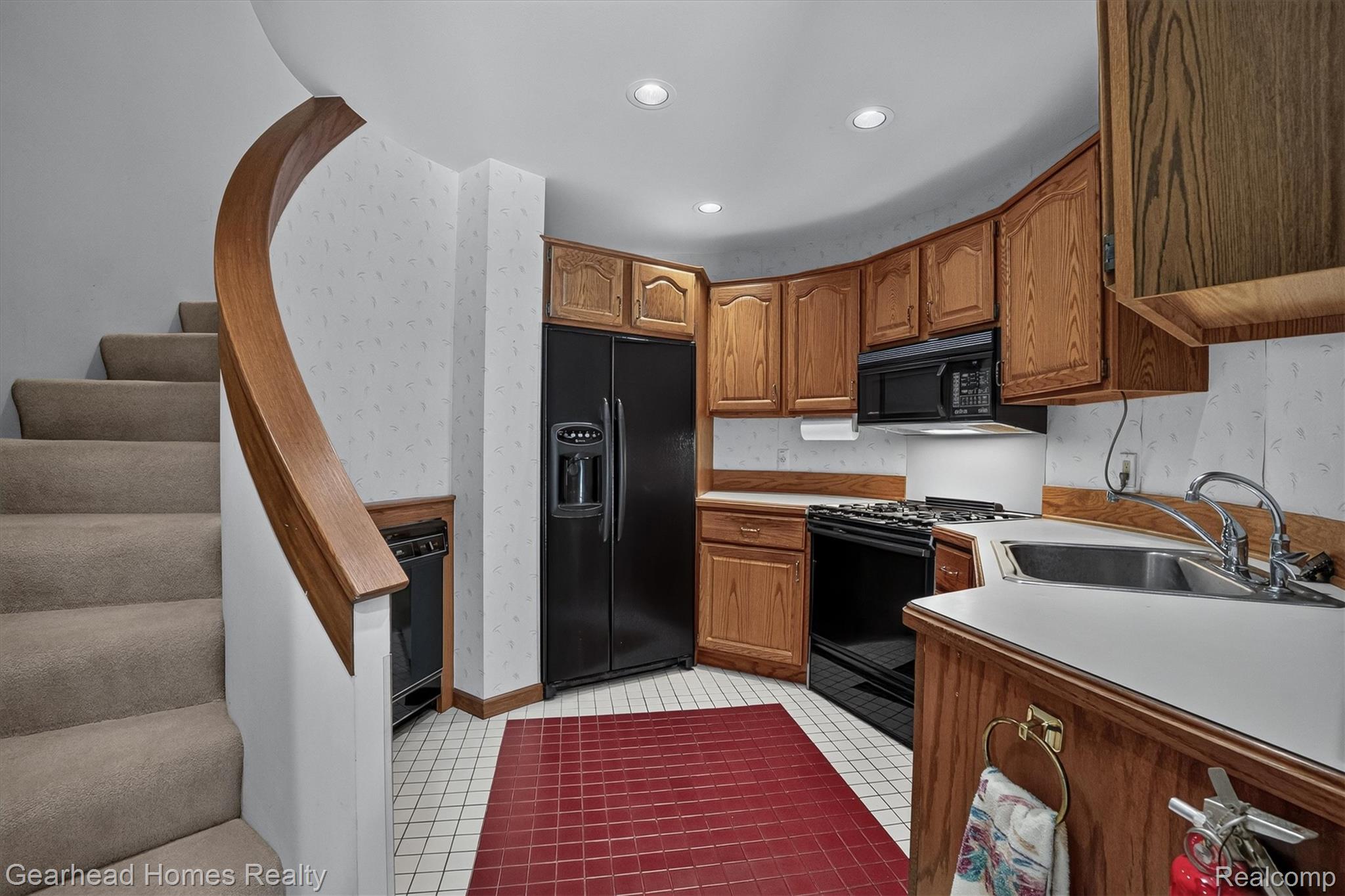 3486 West Drahner Road Oxford, MI 48371 - Photo 10 of 51 Compact kitchen featuring wood cabinetry, white countertops, black appliances, and recessed lighting