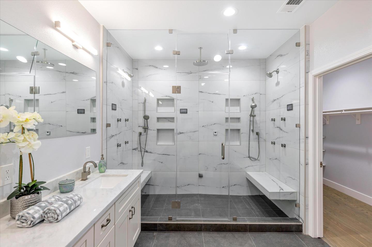 1106 Sprig Way Gilroy, CA 95020 - Photo 19 of 27 a bathroom with a granite countertop sink a shower a mirror and a shower