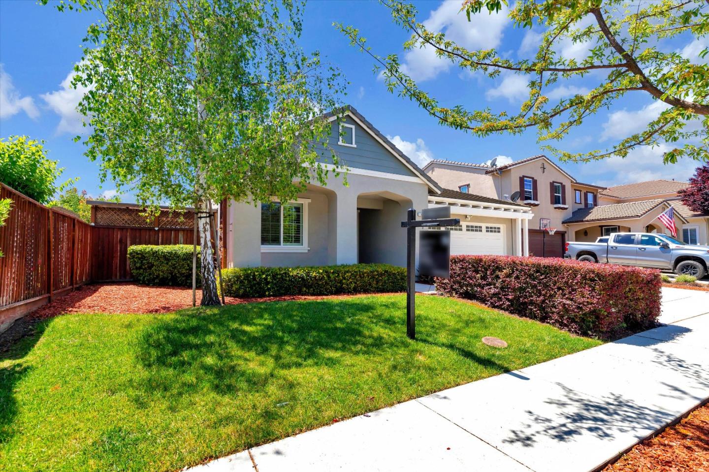 1106 Sprig Way Gilroy, CA 95020 - Photo 2 of 27 a front view of a house with a yard
