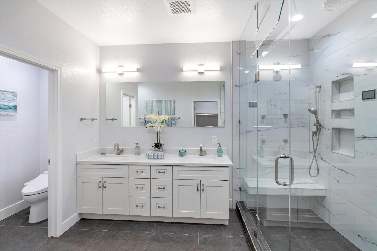 1106 Sprig Way Gilroy, CA 95020 - Photo 21 of 27 a spacious bathroom with double vanity a toilet a a shower a mirror and vanity