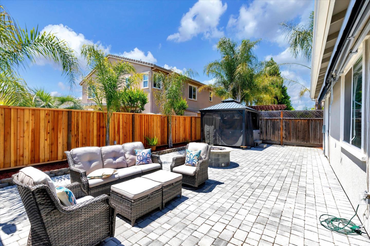 1106 Sprig Way Gilroy, CA 95020 - Photo 25 of 27 a view of a patio with couches chairs and wooden floor