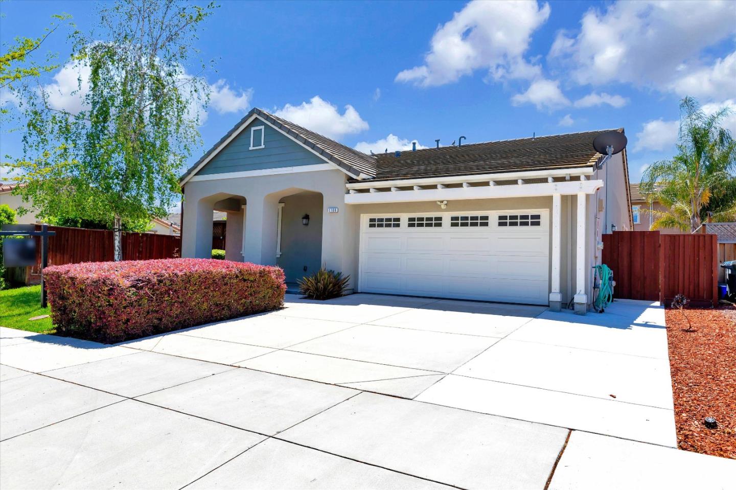 1106 Sprig Way Gilroy, CA 95020 - Photo 3 of 27 a view of house and outdoor space with wooden fence