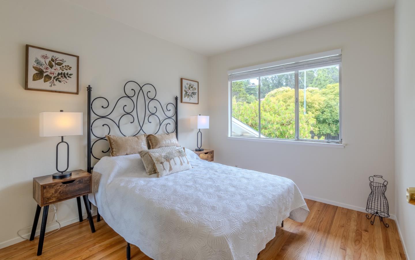 1031 Yosemite Drive Pacifica, CA 94044 - Photo 21 of 40 a bedroom with a bed and a chair