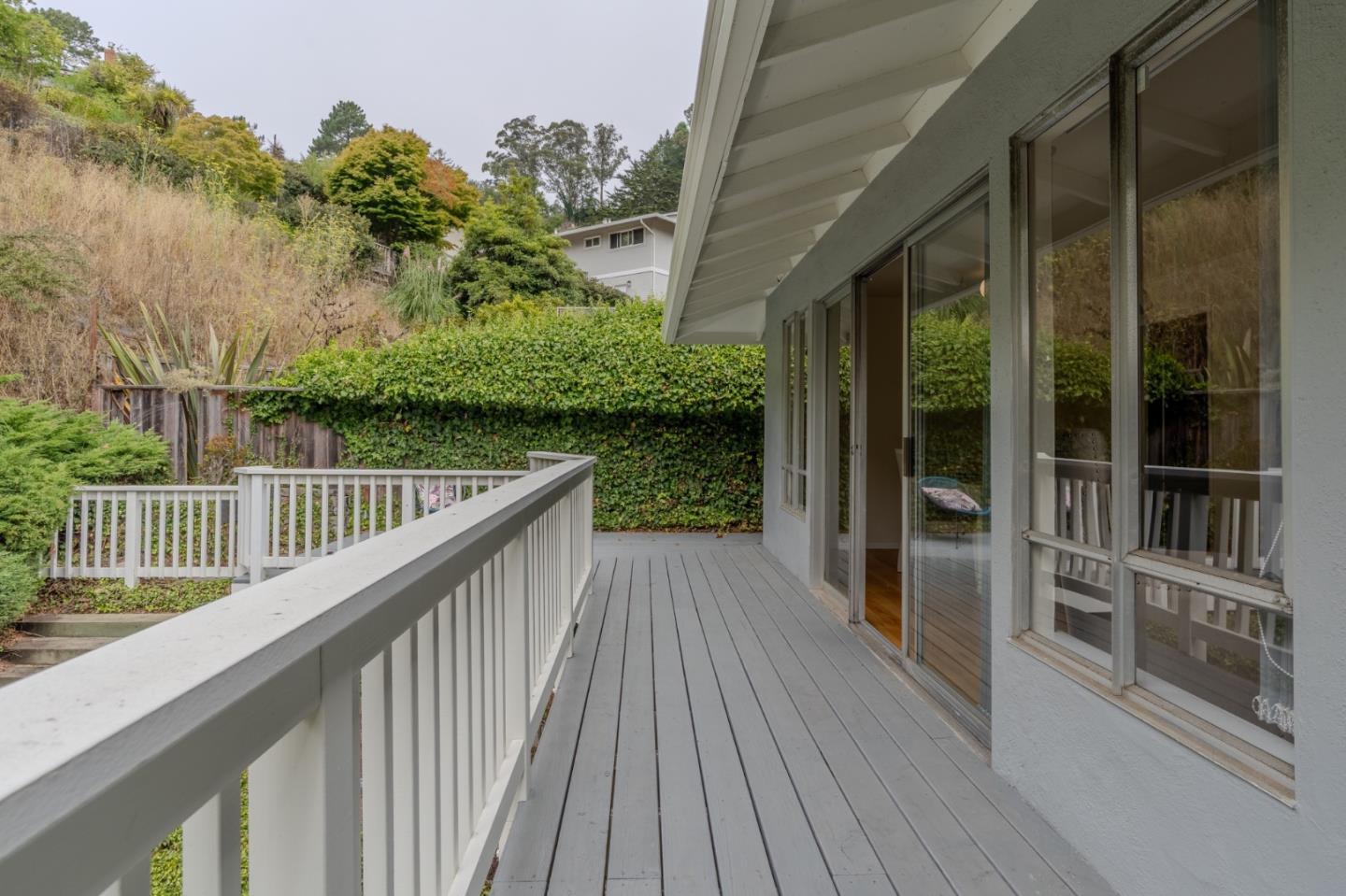 1031 Yosemite Drive Pacifica, CA 94044 - Photo 23 of 40 a view of balcony with wooden floor and fence