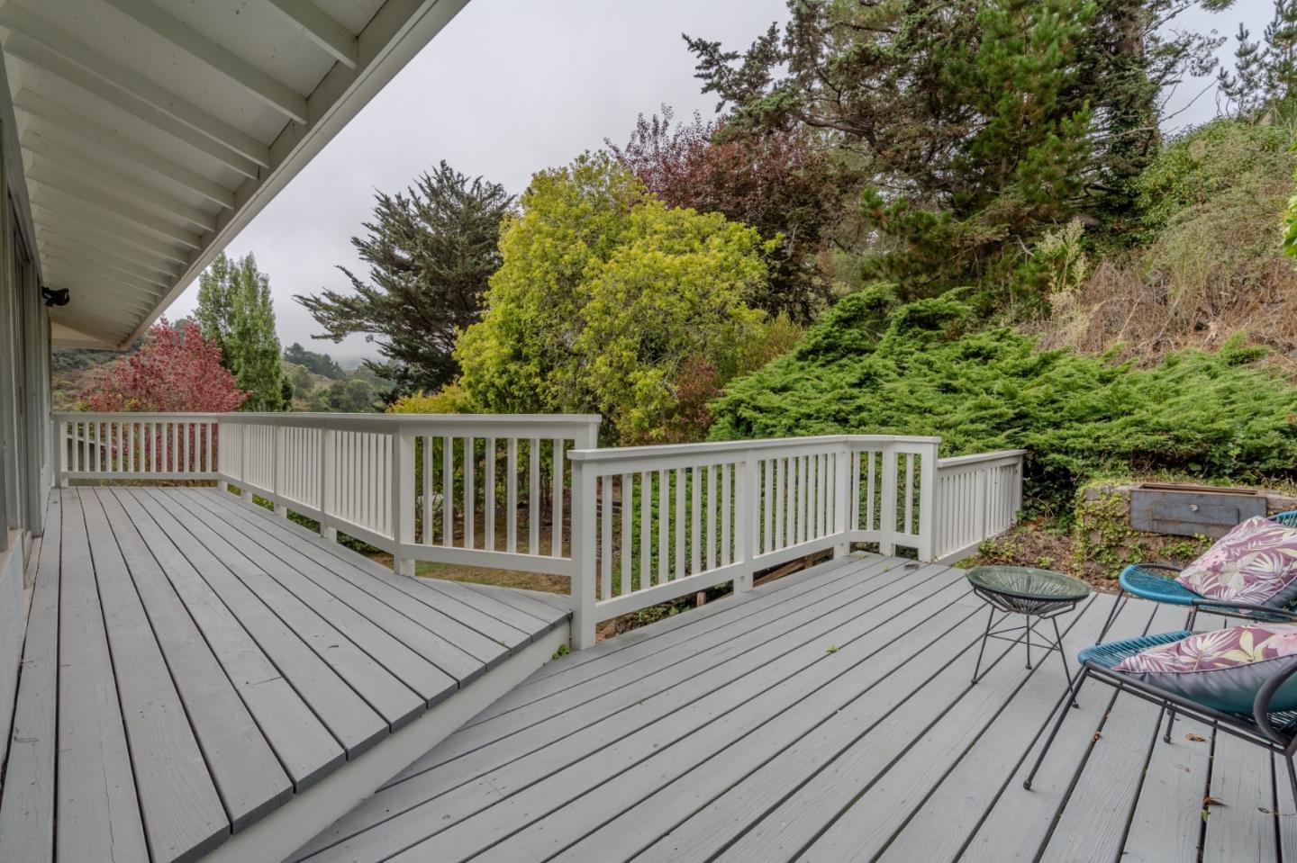 1031 Yosemite Drive Pacifica, CA 94044 - Photo 25 of 40 a balcony with wooden floor and fence