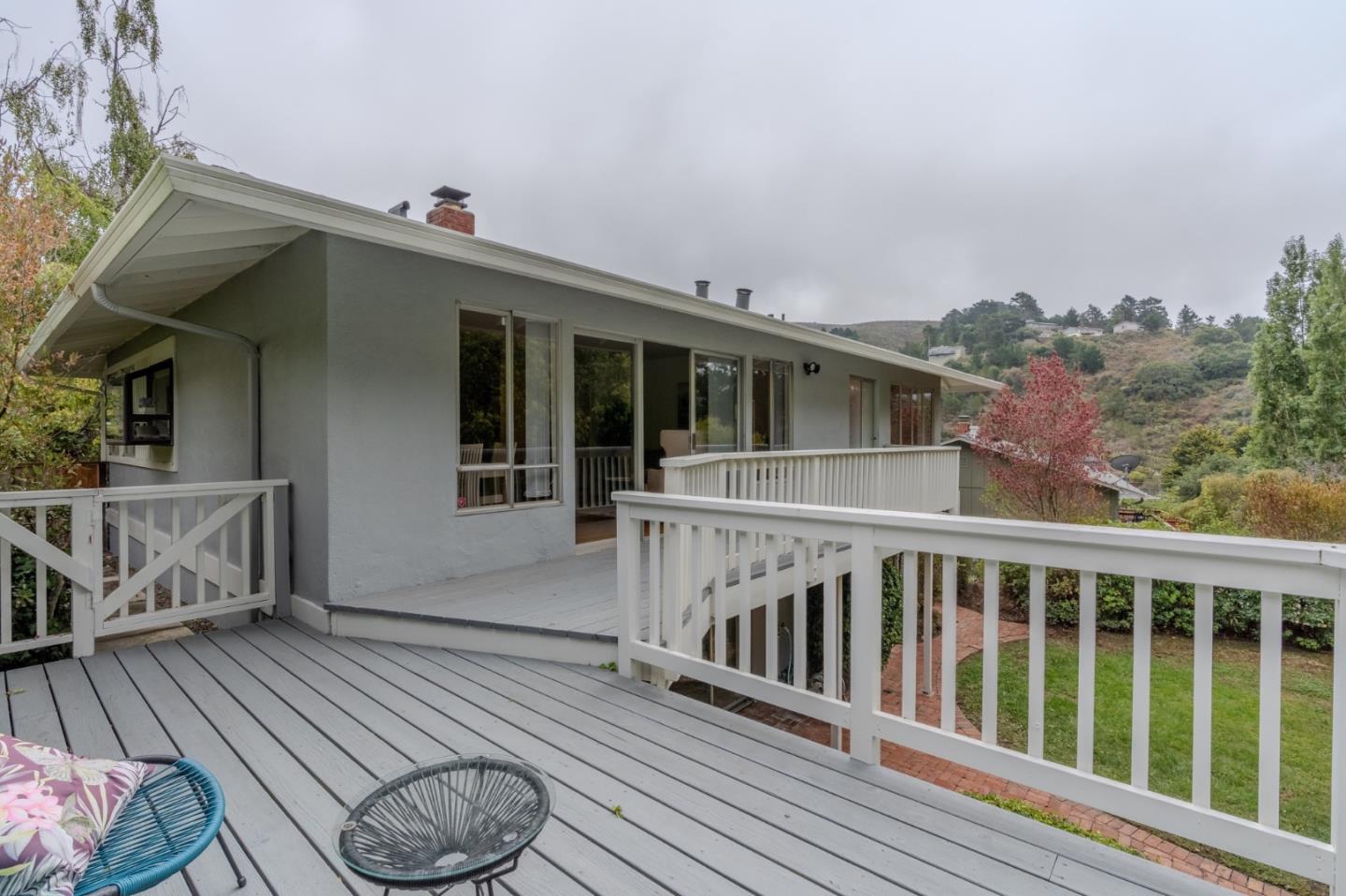 1031 Yosemite Drive Pacifica, CA 94044 - Photo 27 of 40 a view of a wooden deck and a backyard