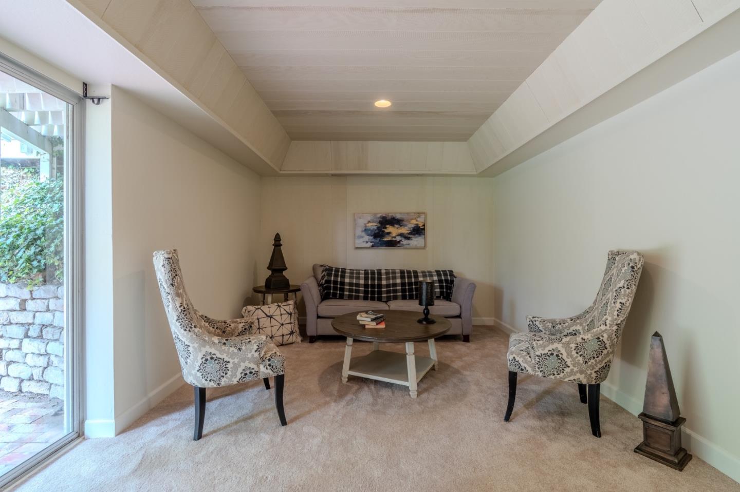 1031 Yosemite Drive Pacifica, CA 94044 - Photo 29 of 40 a living room with furniture and a window
