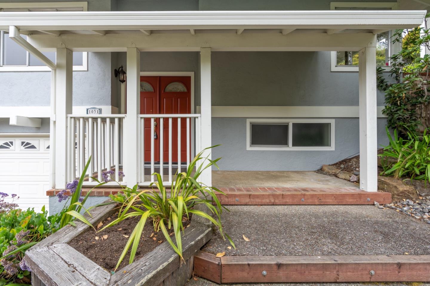 1031 Yosemite Drive Pacifica, CA 94044 - Photo 3 of 40 a front view of a house with a yard