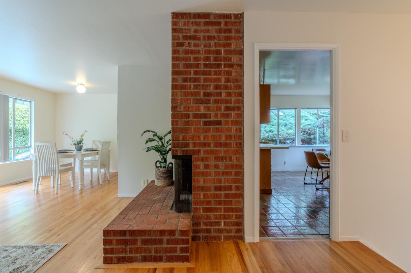 1031 Yosemite Drive Pacifica, CA 94044 - Photo 5 of 40 a view of dining room with furniture and wooden floor