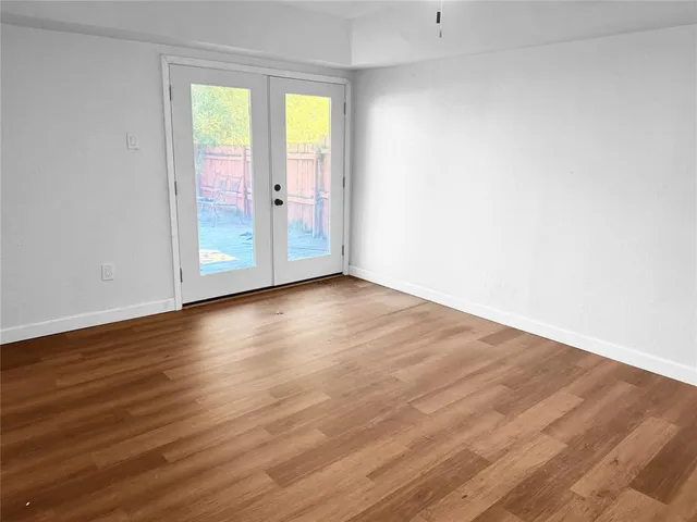 a view of entryway with wooden floor