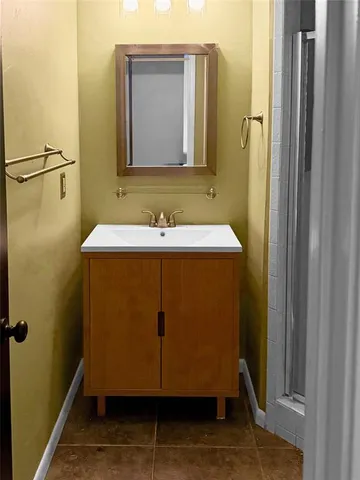 a white toilet sitting next to a blue wall