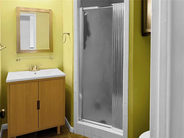 a view of a tree in front of a house