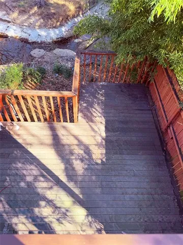 a kitchen with a refrigerator and a stove top oven