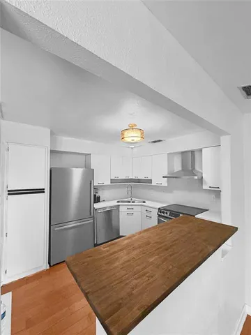 a view of a big room with wooden floor