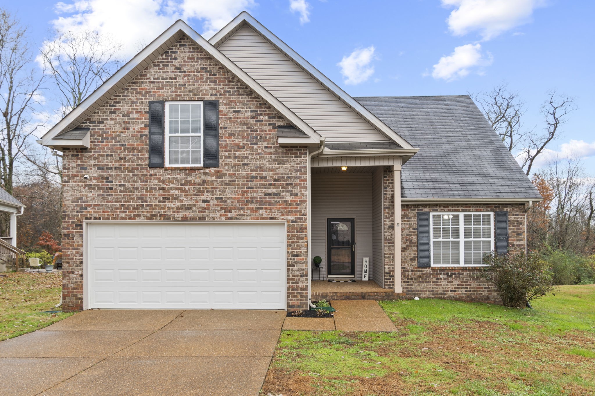 1112 Golf View Way Spring Hill, TN 37174 - Photo 1 of 47 a front view of a house with a yard and garage