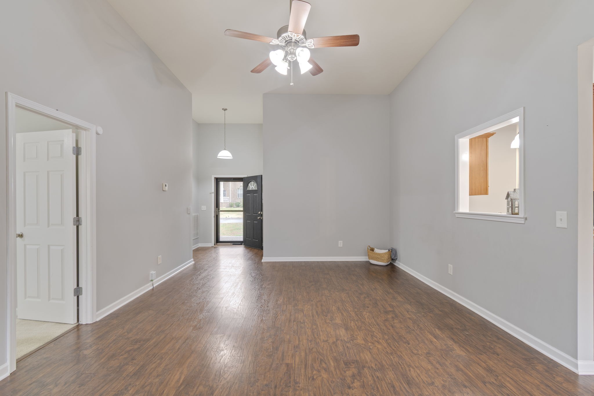 1112 Golf View Way Spring Hill, TN 37174 - Photo 12 of 47 a view of an empty room with window and wooden floor
