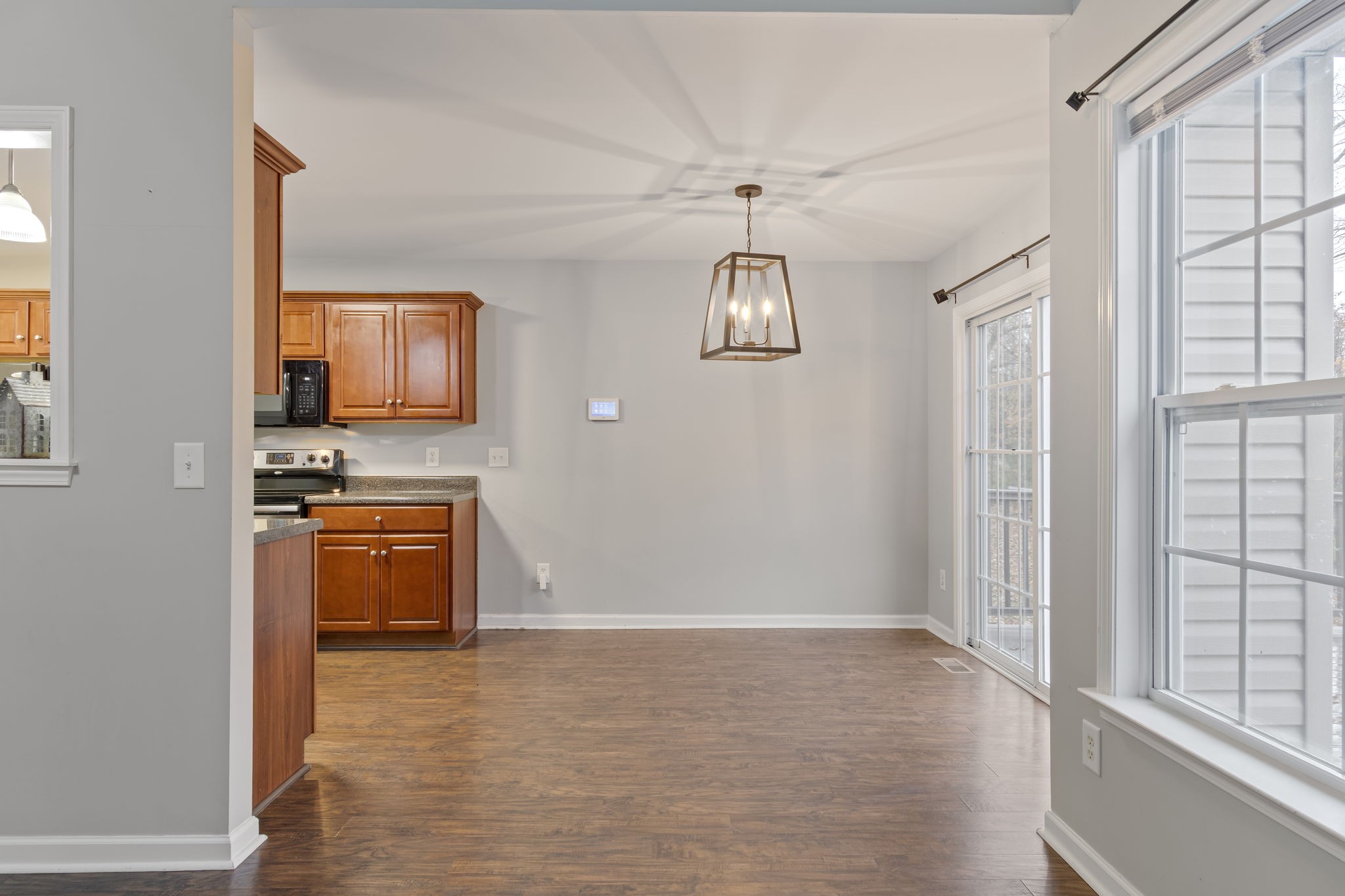 1112 Golf View Way Spring Hill, TN 37174 - Photo 13 of 47 a view of an empty room with kitchen and a window