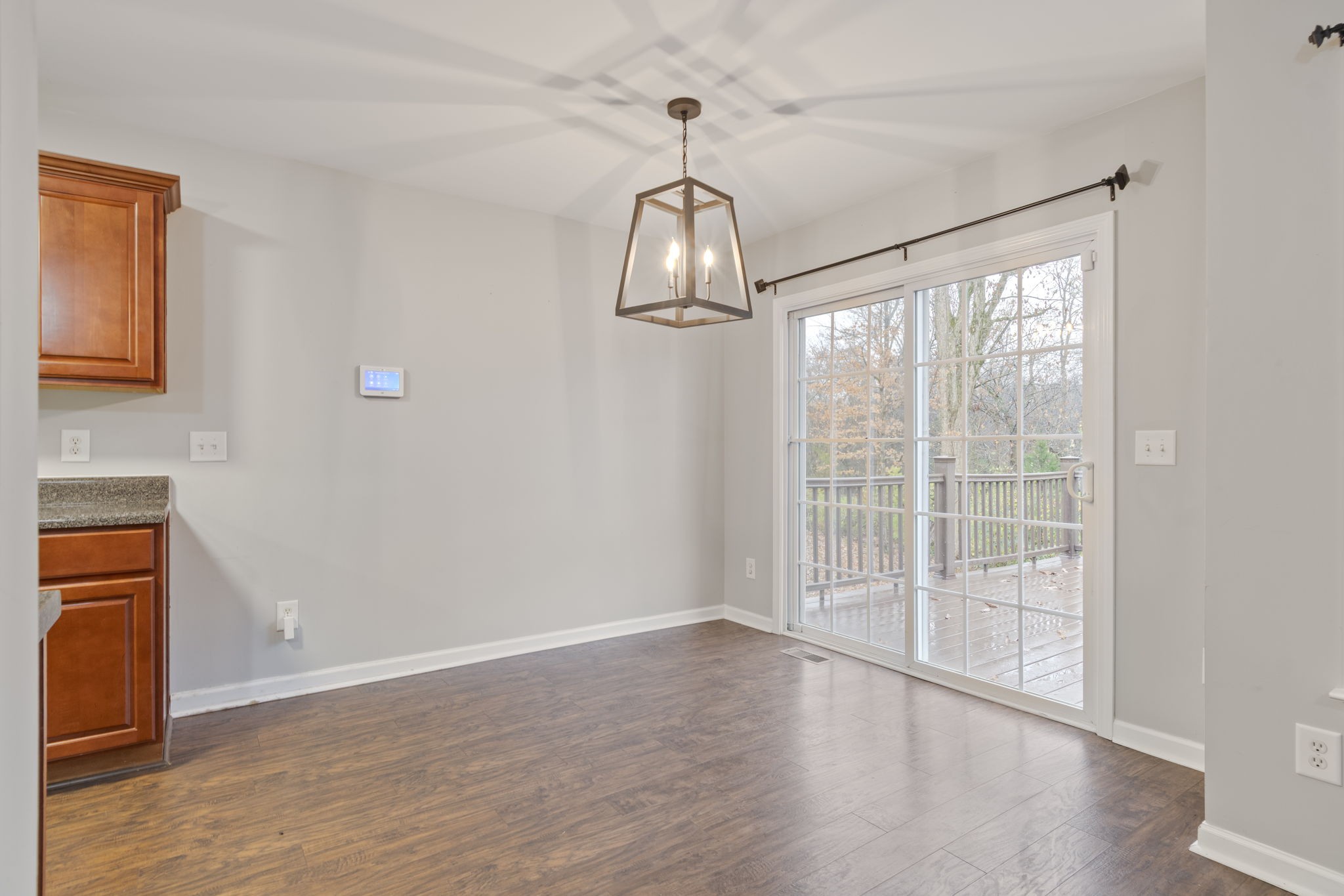 1112 Golf View Way Spring Hill, TN 37174 - Photo 14 of 47 a view of empty room with wooden floor and fan