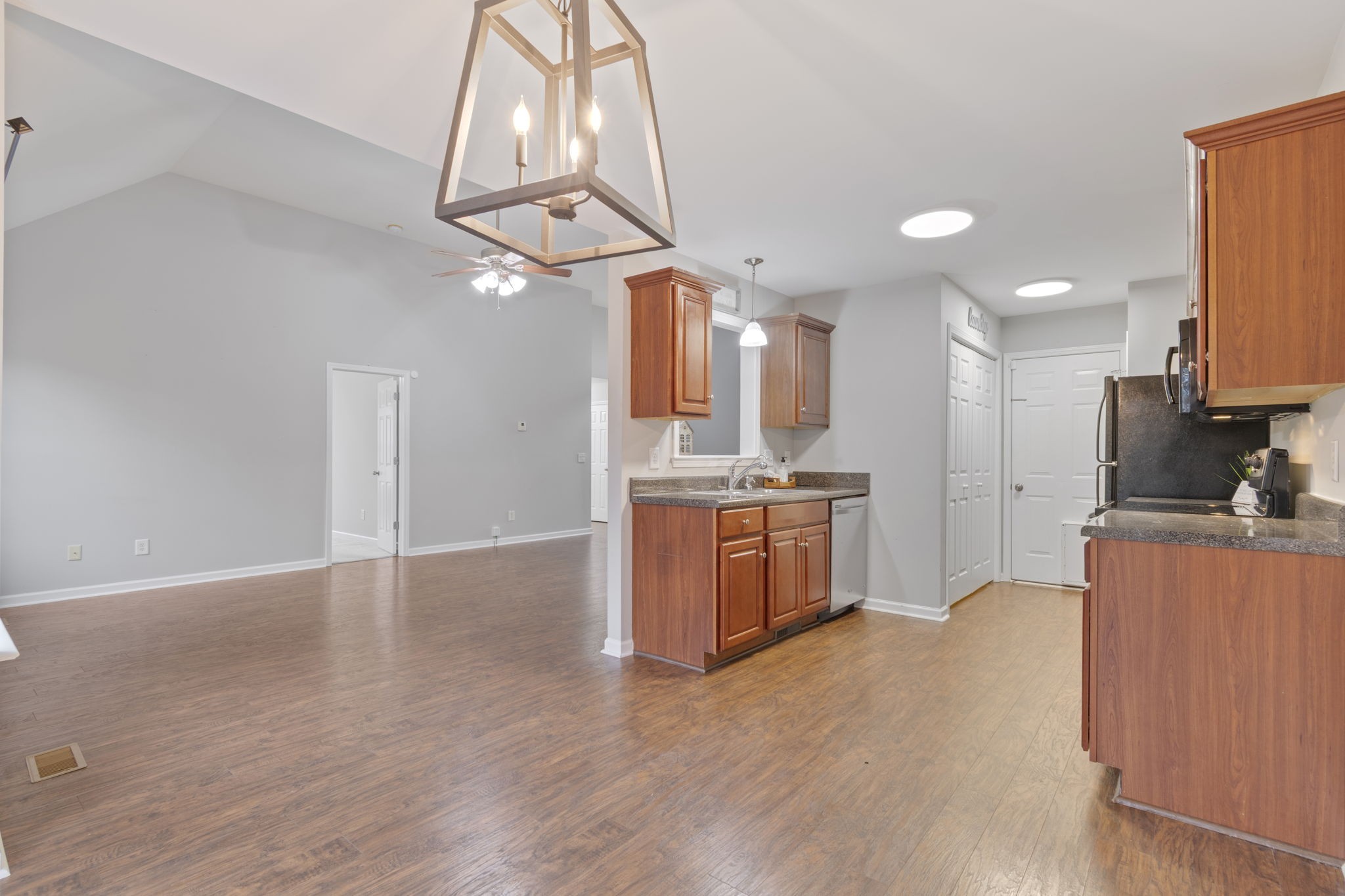 1112 Golf View Way Spring Hill, TN 37174 - Photo 16 of 47 a kitchen with stainless steel appliances kitchen island a sink and a refrigerator
