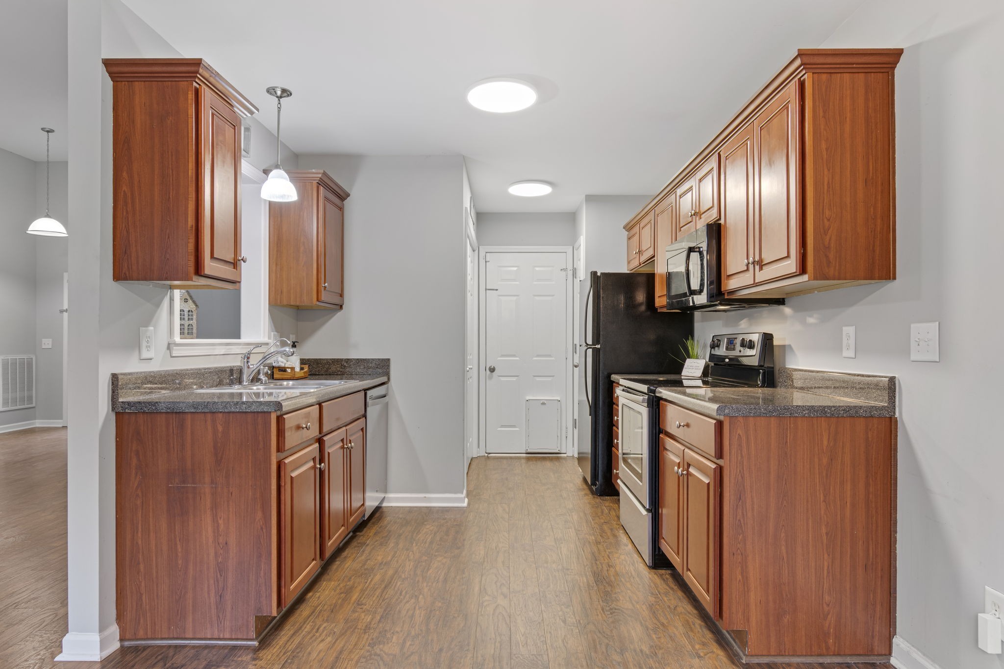 1112 Golf View Way Spring Hill, TN 37174 - Photo 17 of 47 a kitchen with stainless steel appliances granite countertop a stove a sink dishwasher and a refrigerator