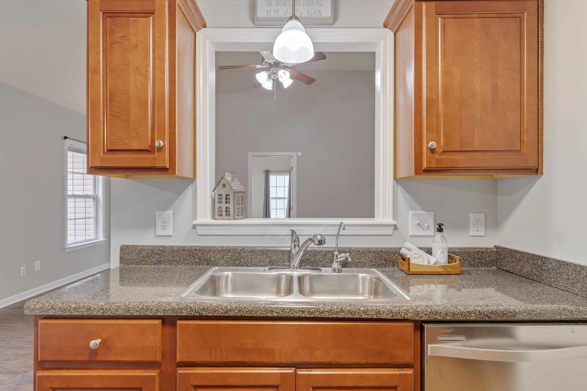 1112 Golf View Way Spring Hill, TN 37174 - Photo 21 of 47 a kitchen with granite countertop a sink stainless steel appliances and cabinets
