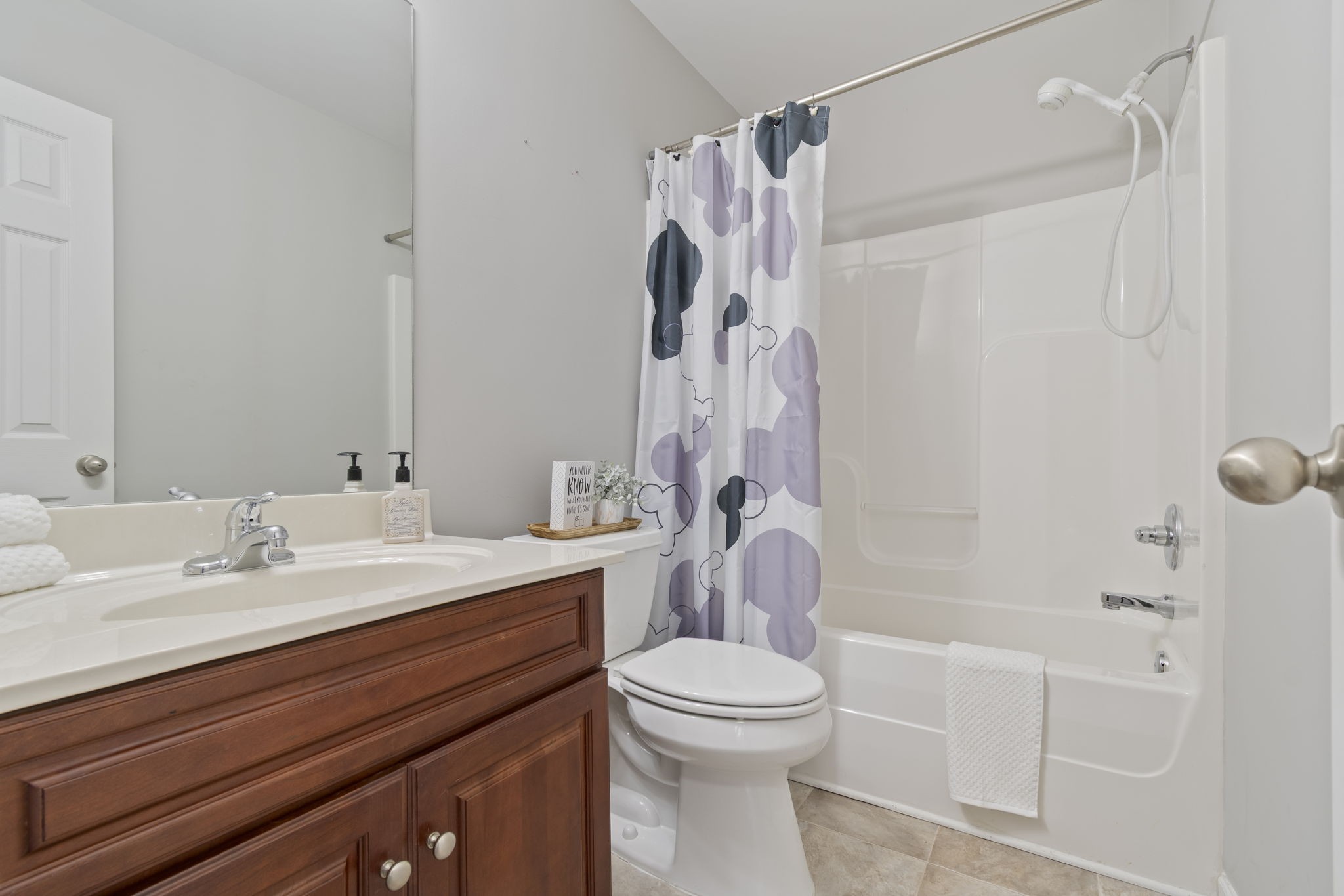 1112 Golf View Way Spring Hill, TN 37174 - Photo 31 of 47 a bathroom with a sink a toilet and a mirror