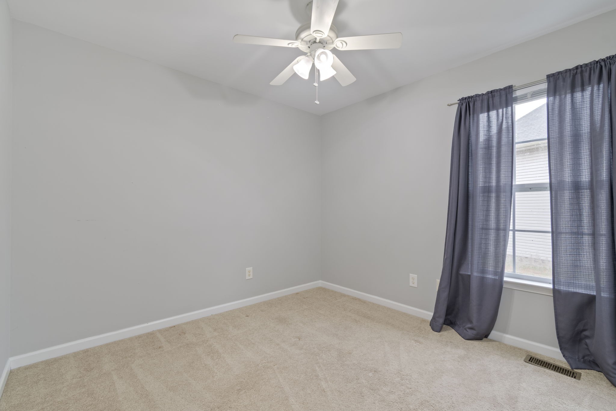 1112 Golf View Way Spring Hill, TN 37174 - Photo 35 of 47 an empty room with windows and fan