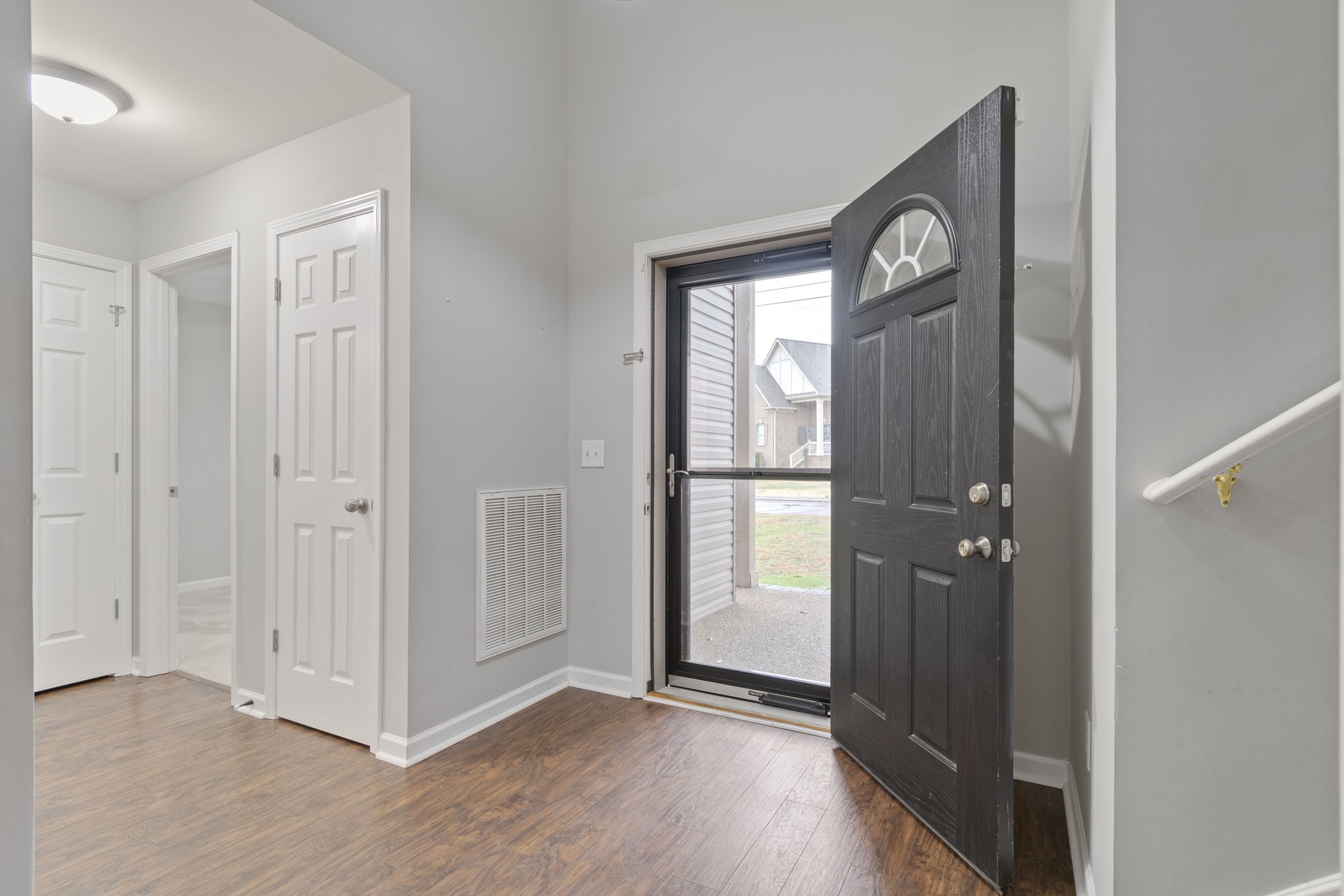 1112 Golf View Way Spring Hill, TN 37174 - Photo 6 of 47 a view of a hallway with wooden floor