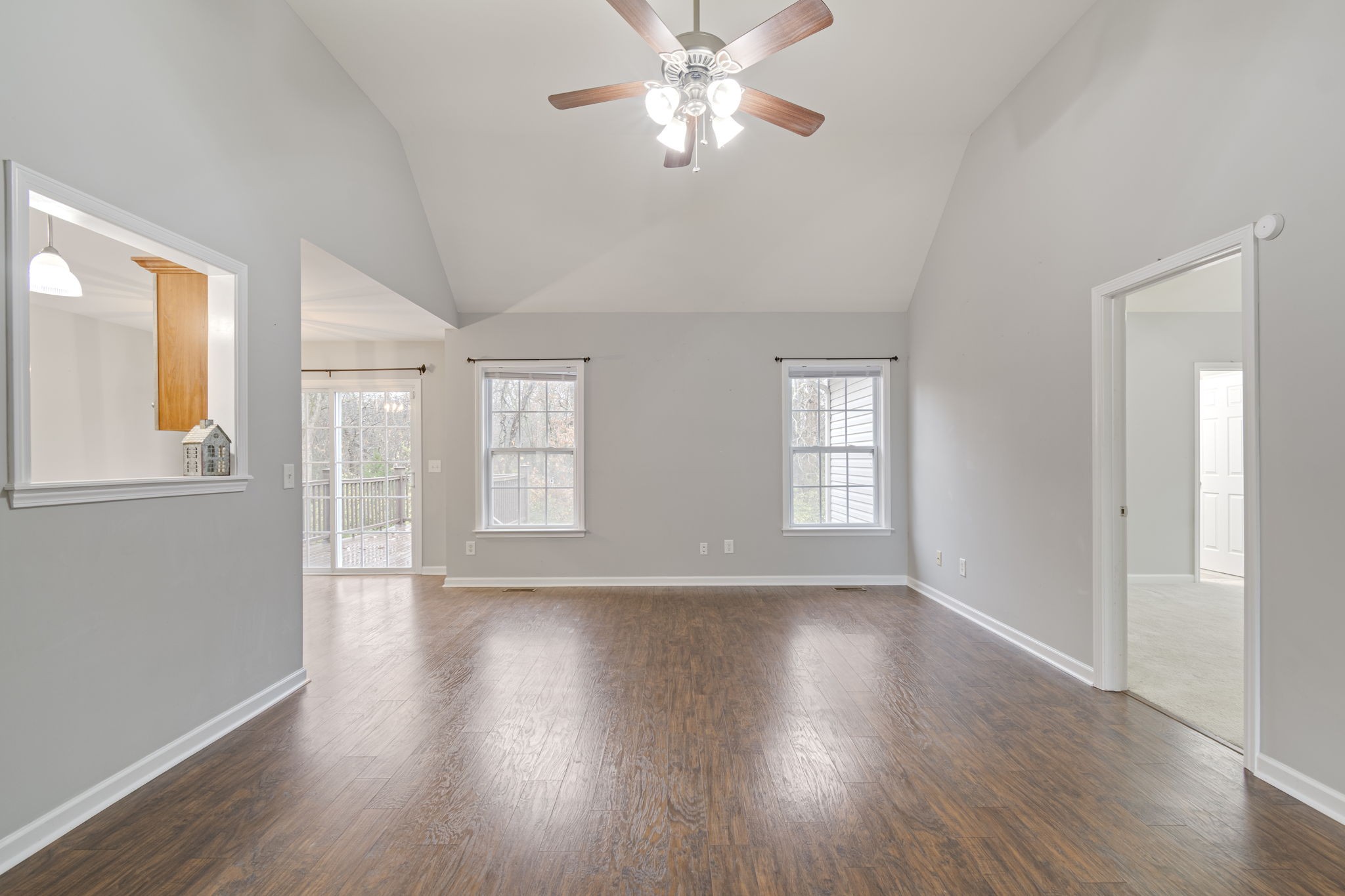 1112 Golf View Way Spring Hill, TN 37174 - Photo 9 of 47 a view of an empty room with wooden floor and a window