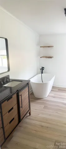 a white bath tub sitting in a bathroom