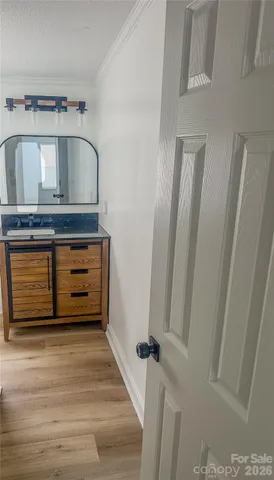 a bathroom with a glass shower door