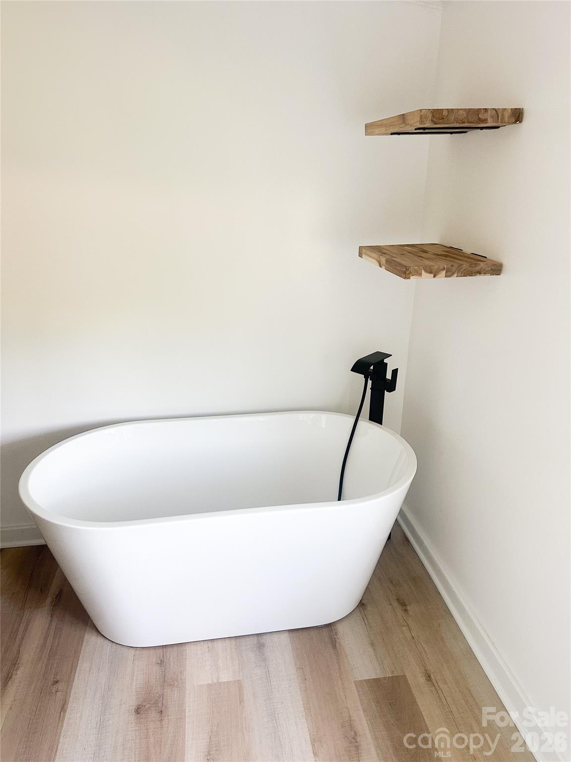 2976 Stephens Road Bethune, SC 29009 - Photo 21 of 24 a white bath tub sitting in a bathroom