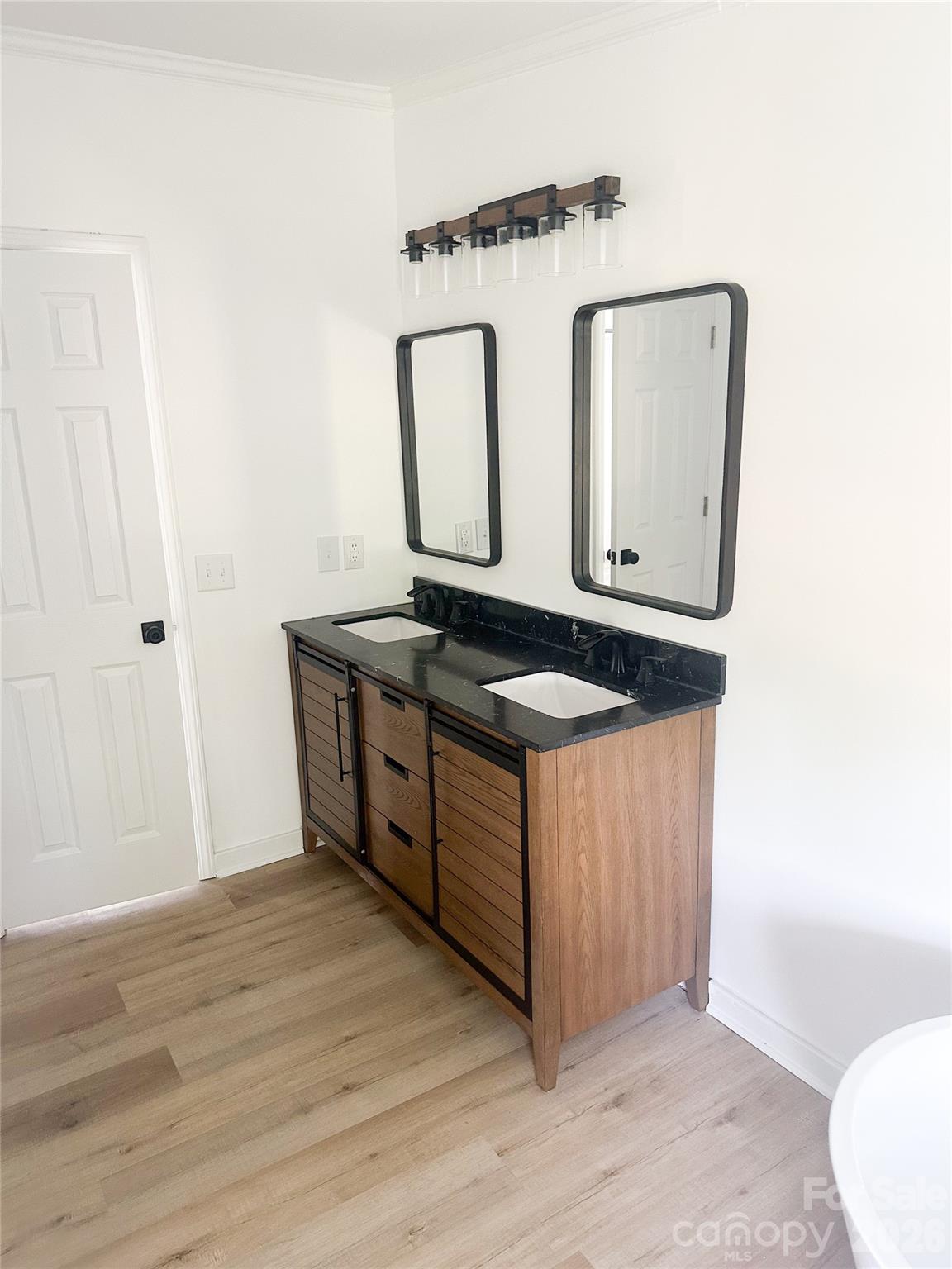 2976 Stephens Road Bethune, SC 29009 - Photo 22 of 24 a view of kitchen with wooden floor washer dryer and wooden floor
