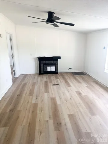 a view of a livingroom with wooden floor