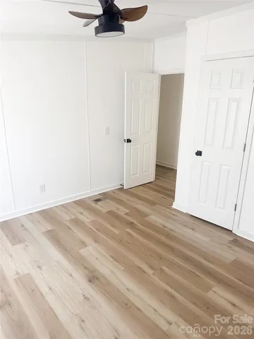 a view of a livingroom with wooden floor