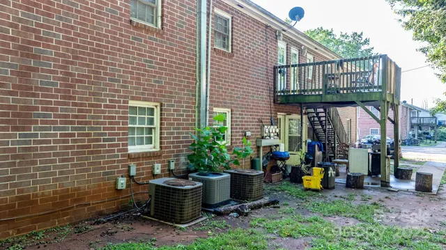a view of a house with sitting area and garden